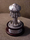 Custom pewter sculpture mounted on an oak base