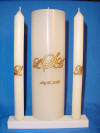 Ivory candle with gold monogram script outlined in dark brown